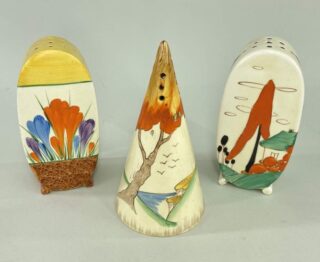 Three Clarice Cliff Sugar Casters